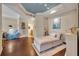 Bright living room with hardwood floors, comfy seating, and large artwork at 501 Mirasol Cir # 213, Celebration, FL 34747