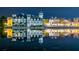 Night view of waterfront with building reflections at 501 Mirasol Cir # 213, Celebration, FL 34747