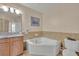 Corner bathtub and granite countertop vanity at 501 Mirasol Cir # 213, Celebration, FL 34747