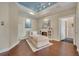 Relaxing sitting room with a chaise lounge and built-in shelving at 501 Mirasol Cir # 213, Celebration, FL 34747