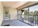 Screened balcony overlooking a wooded area and parking lot at 623 Dory Ln # 308, Altamonte Springs, FL 32714