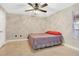 Cozy bedroom with ceiling fan, tile floors, and ample natural light at 623 Dory Ln # 308, Altamonte Springs, FL 32714