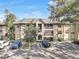 Two-story building exterior with screened balconies at 623 Dory Ln # 308, Altamonte Springs, FL 32714
