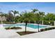 Refreshing community pool with lounge chairs and palm trees at 623 Dory Ln # 308, Altamonte Springs, FL 32714