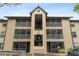 Condo building entrance with balconies and screened porches at 623 Dory Ln # 308, Altamonte Springs, FL 32714