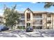 Two-story condo building with balconies, screened porches, and ample parking at 623 Dory Ln # 308, Altamonte Springs, FL 32714