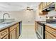 Kitchen boasts granite counters, stainless steel appliances at 623 Dory Ln # 308, Altamonte Springs, FL 32714