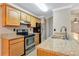 Modern kitchen with stainless steel appliances and granite countertops at 623 Dory Ln # 308, Altamonte Springs, FL 32714