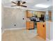 Well-equipped kitchen with light wood cabinets and granite counters at 623 Dory Ln # 308, Altamonte Springs, FL 32714