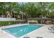 Community pool with lounge chairs and a shaded area at 623 Dory Ln # 308, Altamonte Springs, FL 32714