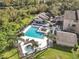Aerial view of community pool, spa, and surrounding landscape at 623 Dory Ln # 308, Altamonte Springs, FL 32714
