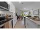 Modern kitchen with granite countertops and stainless steel appliances at 692 Preston Cove Dr, St Cloud, FL 34771