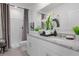 Elegant bathroom with double vanity and walk-in shower at 692 Preston Cove Dr, St Cloud, FL 34771