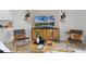 Living area with stylish chairs and a modern media console at 692 Preston Cove Dr, St Cloud, FL 34771