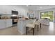 Modern kitchen with island, stainless steel appliances, and granite countertops at 692 Preston Cove Dr, St Cloud, FL 34771