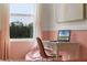 Cozy bedroom with a desk, chair, and large window at 692 Preston Cove Dr, St Cloud, FL 34771