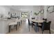 Open concept dining area with marble top table and seating for four at 692 Preston Cove Dr, St Cloud, FL 34771