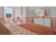 Cozy bedroom with built-in desk and calming color scheme at 692 Preston Cove Dr, St Cloud, FL 34771