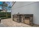 Gorgeous outdoor kitchen with grill and refrigerator at 8391 Laureate Blvd, Orlando, FL 32827