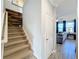 Staircase with carpeted steps and wood accent wall at 987 Nathan Ridge Rd, Clermont, FL 34715