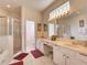 Elegant Primary bathroom with double vanity, a soaking tub, and a separate shower at 1102 Golf Course Pkwy, Davenport, FL 33837