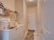 Laundry room with washer, dryer, and extra storage at 1102 Golf Course Pkwy, Davenport, FL 33837