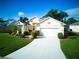 Beautiful one-story home with two-car garage and manicured lawn at 1102 Golf Course Pkwy, Davenport, FL 33837