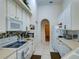 Efficient kitchen featuring white cabinets, ample counter space, and modern appliances at 1102 Golf Course Pkwy, Davenport, FL 33837