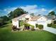 Stunning one-story house with a two-car garage and lush landscaping at 1102 Golf Course Pkwy, Davenport, FL 33837