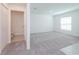 Spacious bonus room with grey carpet and powder room at 1432 Punta Gorda Dr, Kissimmee, FL 34759