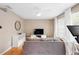 Spacious living room with gray couch and large windows, hardwood floors at 1820 Blaine Ter, Winter Park, FL 32792