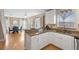 Modern kitchen with white cabinets, granite countertops, and stainless steel appliances at 1820 Blaine Ter, Winter Park, FL 32792