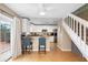 Modern kitchen with white cabinets, stainless steel appliances, and breakfast bar at 1820 Blaine Ter, Winter Park, FL 32792