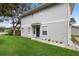 Gray house with a dark blue front door and nicely landscaped yard at 1820 Blaine Ter, Winter Park, FL 32792