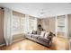 Relaxing living room with gray couch, ceiling fan, and large windows at 1820 Blaine Ter, Winter Park, FL 32792