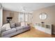 Living room with gray couch, decorative pillows, and white shelving unit at 1820 Blaine Ter, Winter Park, FL 32792