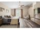 Spacious main bedroom with a large bed, window, and sitting area at 1820 Blaine Ter, Winter Park, FL 32792