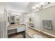 Primary bathroom with granite countertops, double sinks, and large mirror at 1820 Blaine Ter, Winter Park, FL 32792
