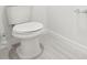 Simple, clean bathroom with a toilet and tile floor at 2315 White Tail St, Davenport, FL 33837