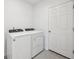 Laundry room with washer and dryer, and tile flooring at 2315 White Tail St, Davenport, FL 33837