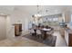 Open concept kitchen and dining area with wood table and chairs at 2321 Lobelia Dr, Lake Mary, FL 32746