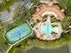 Aerial view of community pool, tennis courts, and clubhouse at 2321 Lobelia Dr, Lake Mary, FL 32746