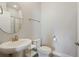 Clean bathroom with a pedestal sink, toilet and shower at 2321 Lobelia Dr, Lake Mary, FL 32746