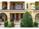 Townhome's front entrance with porch and well-manicured landscaping at 2321 Lobelia Dr, Lake Mary, FL 32746