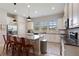 Modern kitchen with white cabinets, granite counters and island at 2321 Lobelia Dr, Lake Mary, FL 32746