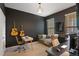 Home office with a desk, comfortable seating, and built-in entertainment center at 2321 Lobelia Dr, Lake Mary, FL 32746