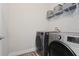 Laundry room with washer, dryer, and shelving at 2321 Lobelia Dr, Lake Mary, FL 32746