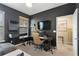 Modern home office featuring a workspace and relaxing seating area at 2321 Lobelia Dr, Lake Mary, FL 32746