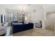 Spacious living room with blue sofa and tile floors at 2321 Lobelia Dr, Lake Mary, FL 32746
