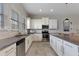 Modern kitchen with white cabinets and granite countertops at 2321 Lobelia Dr, Lake Mary, FL 32746